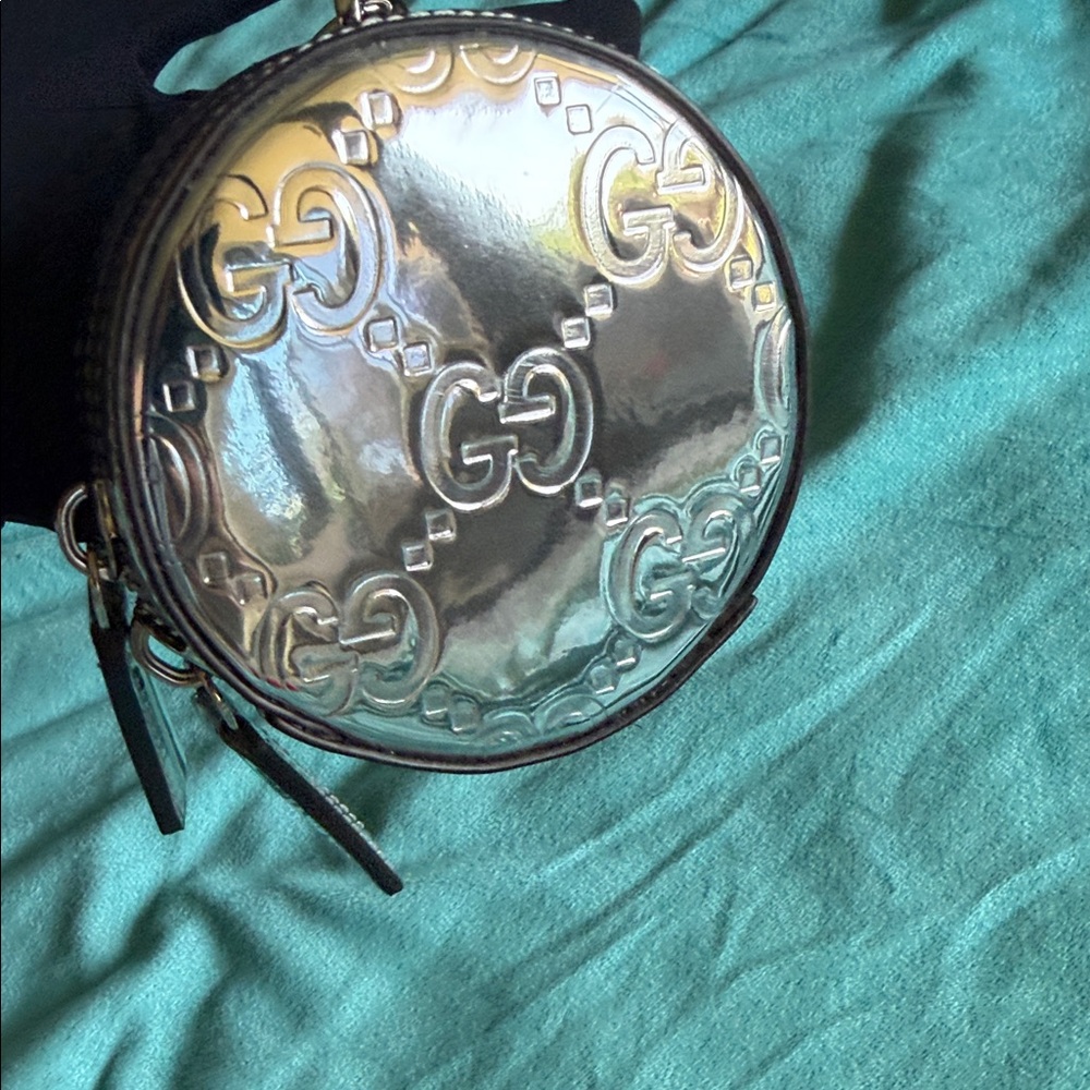 Gucci Silver Embossed GG Round Mini Coin pouch